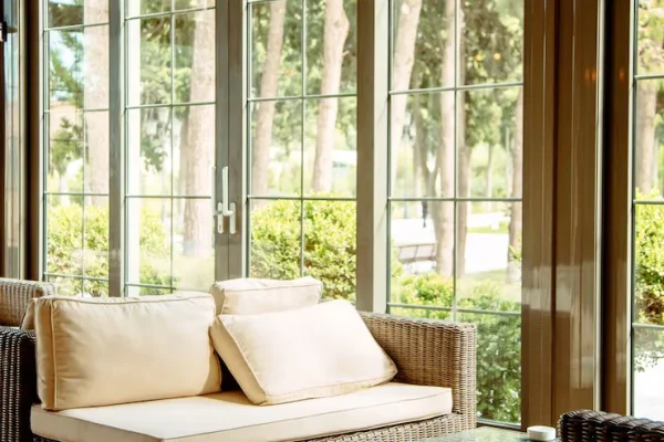 outdoor-sofa-with-beige-cushions-coffee-table-front-restaurant-window_140725-2562.webp